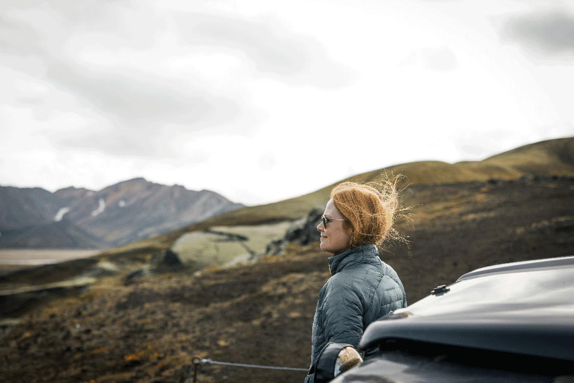 A Woman admiring the volcanic landscape