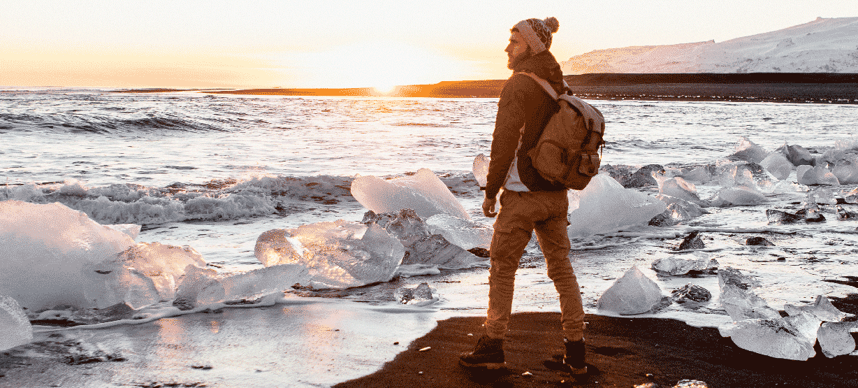 man enjoying the sunset at the Diamond beach in Iceland
